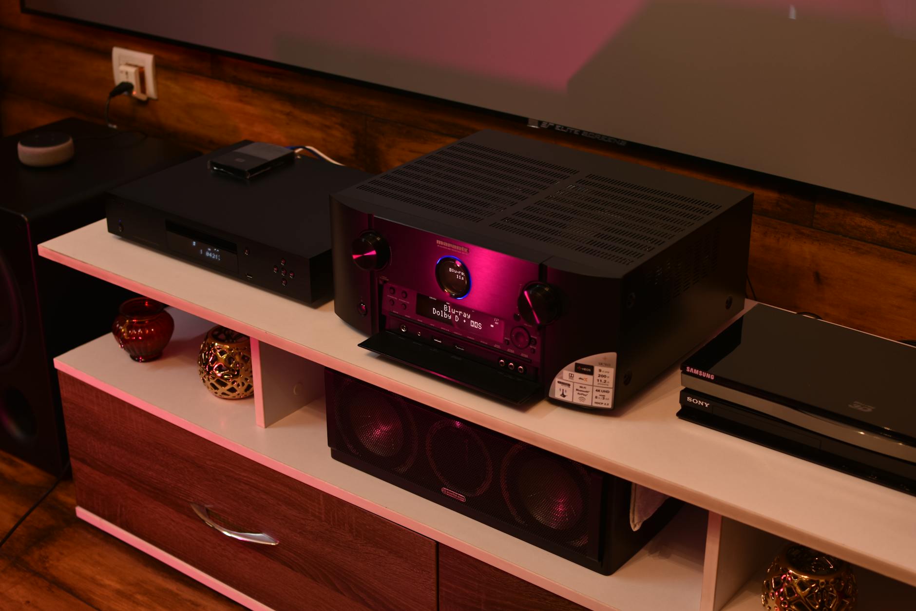 A sophisticated home theater setup featuring a modern amplifier surrounded by speakers, ideal for electrifying music experiences.